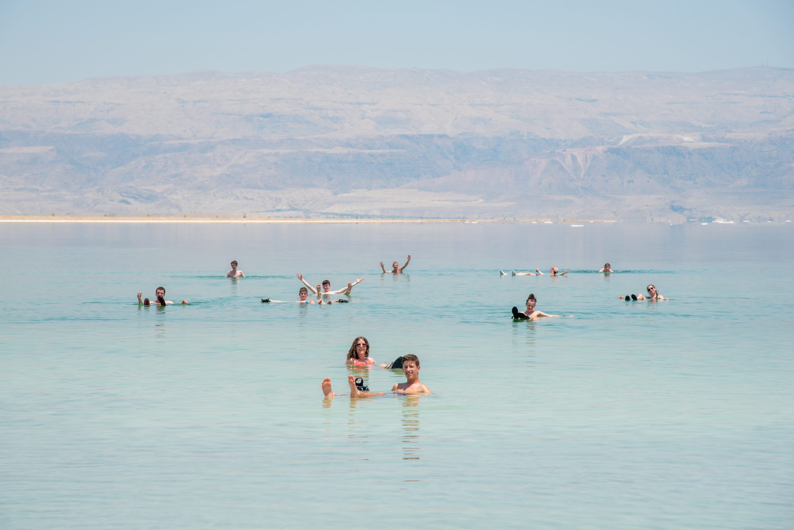 Teens floating in the Dead Sea in Israel