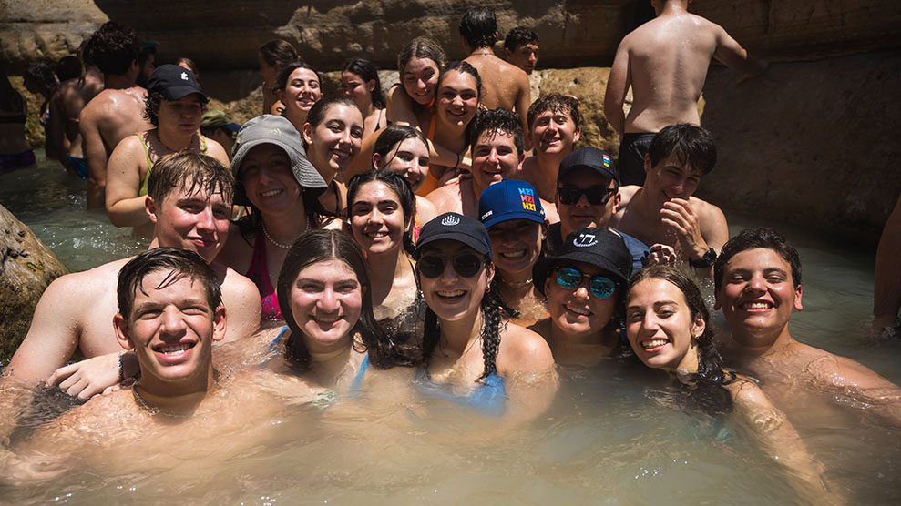 Group shot of teens in water