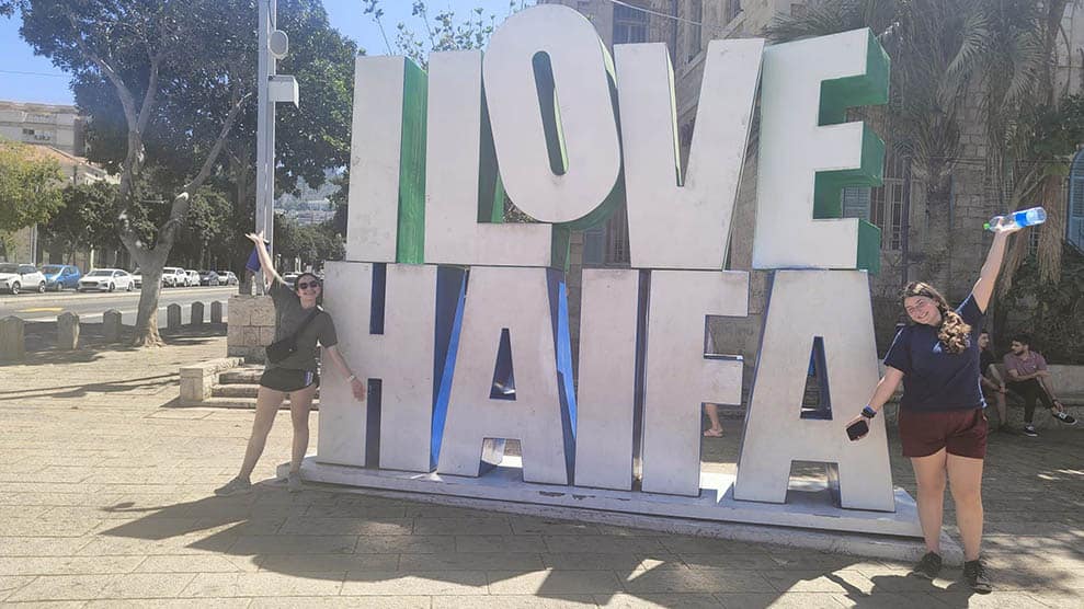 Girls in front of I Love Haifa sign