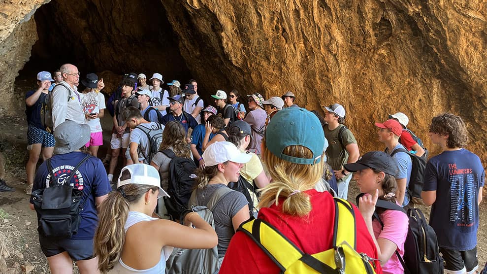 Group shot, teens entering cave